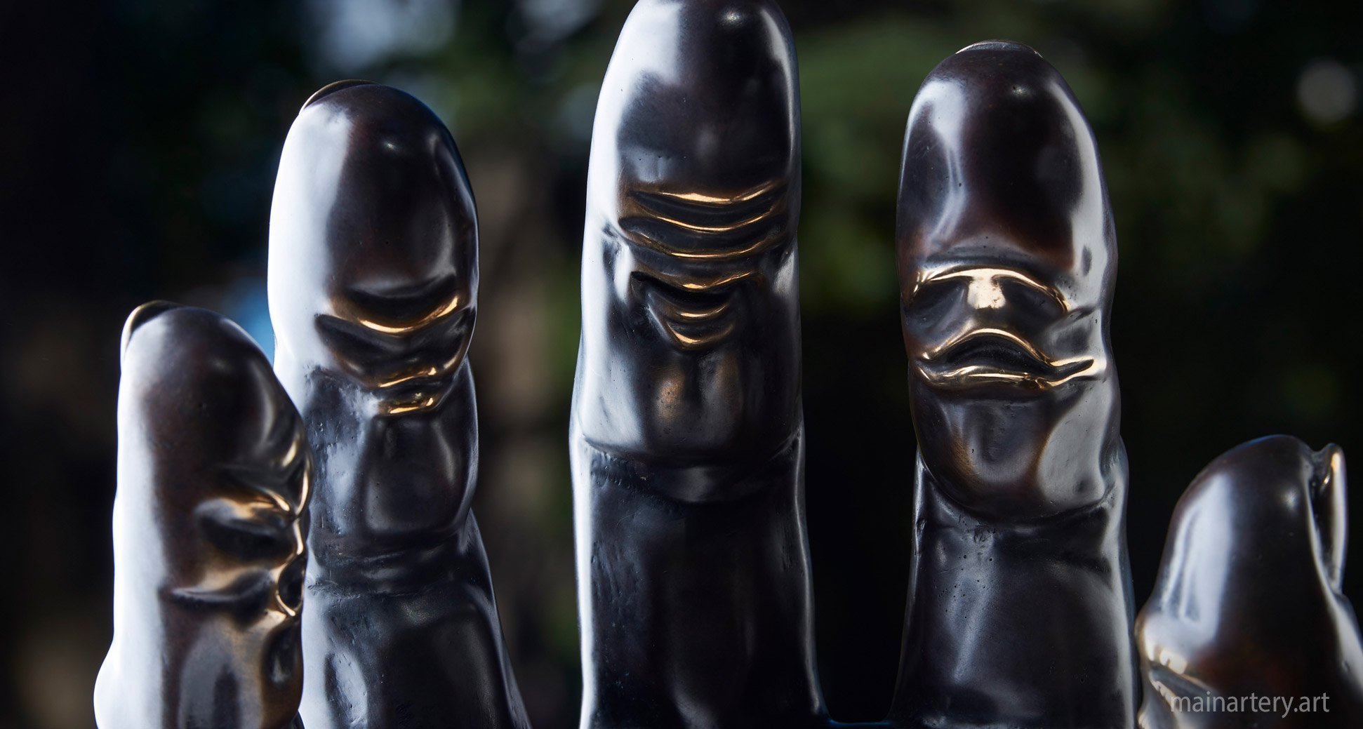 medium patina face finger sculpture image