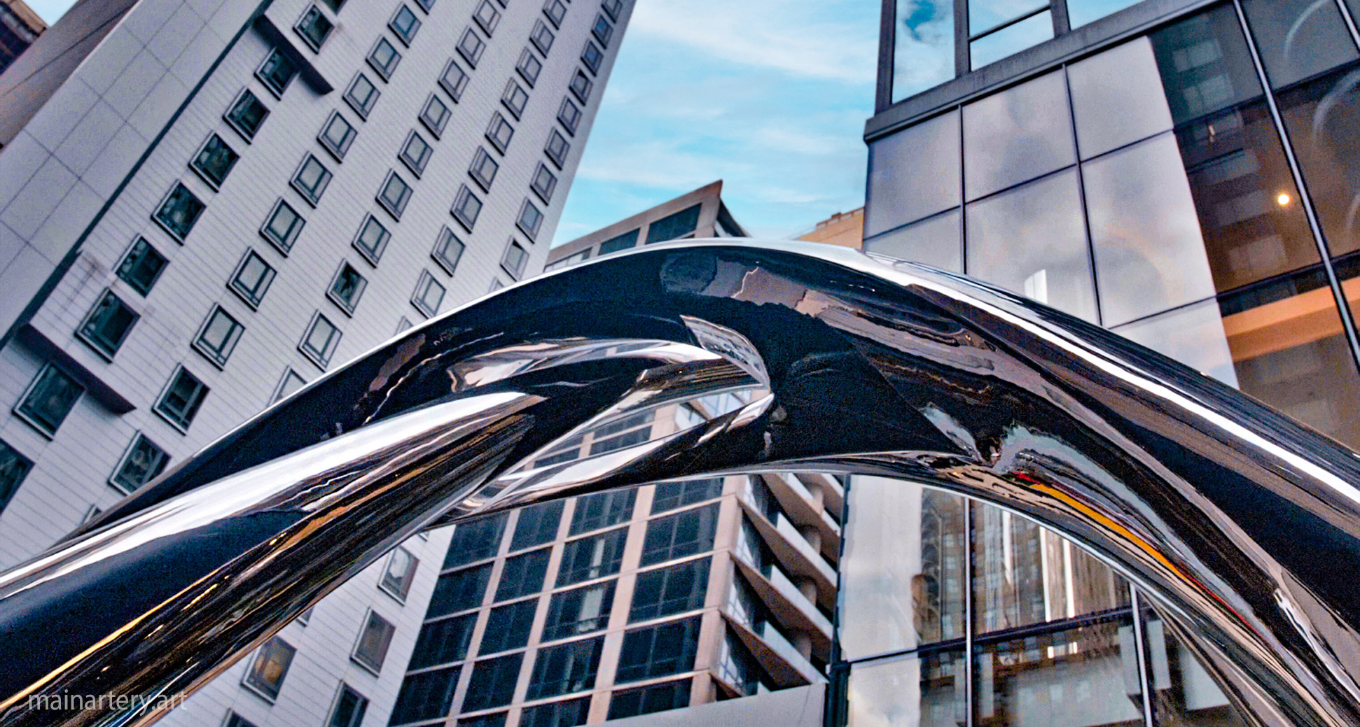 Building Entrance Manhattan Stainless Infinity Sculpture, a symbol of endless possibilities in urban art