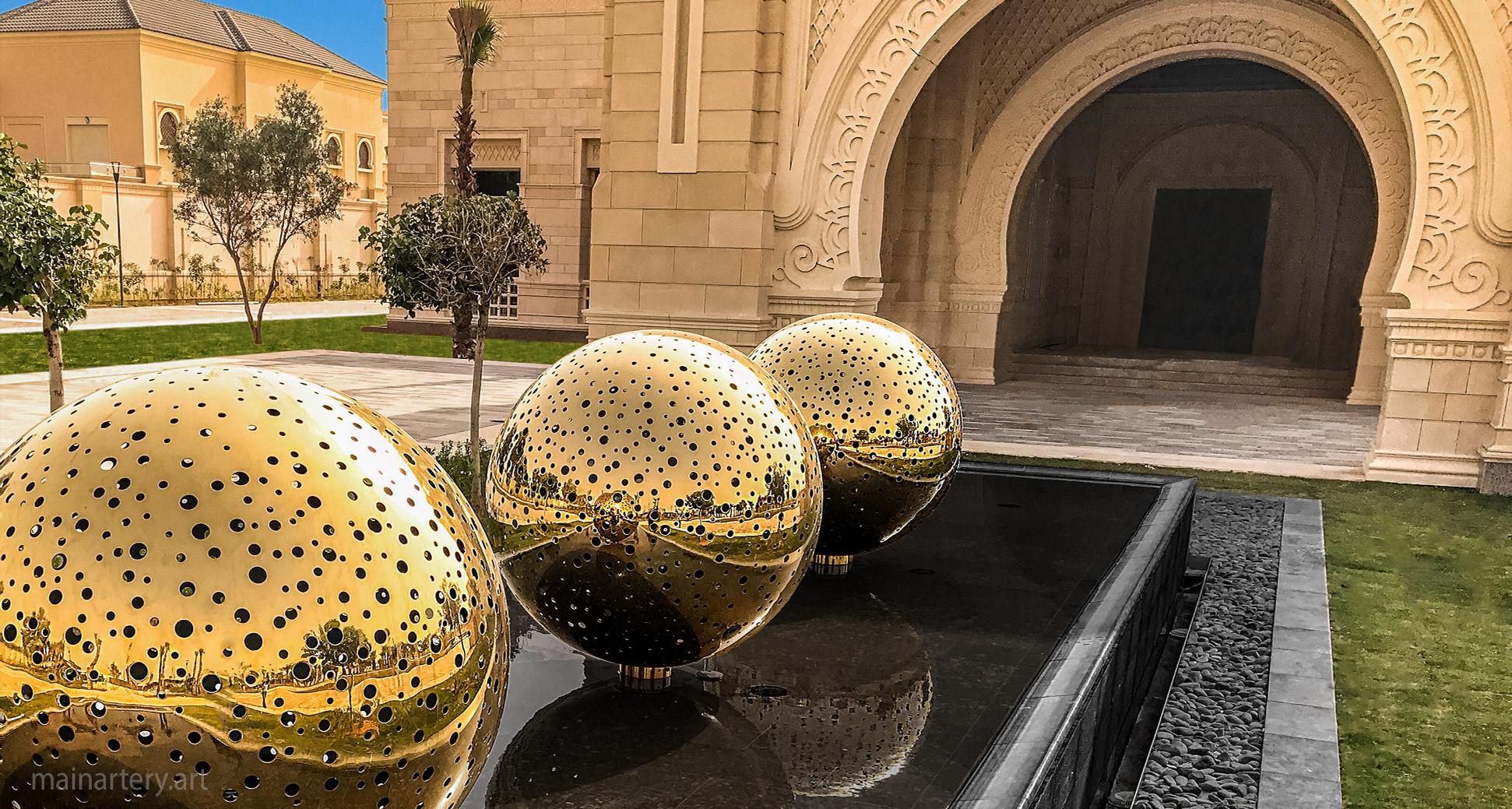 sheikhs royal palace entrance huge sphere stainless steel sculptures image