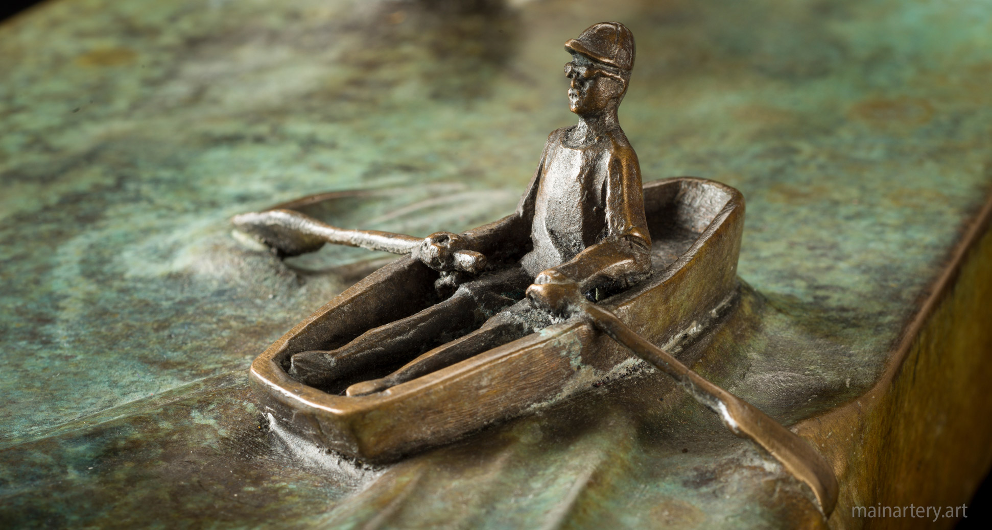 small bronze boat rowing art image